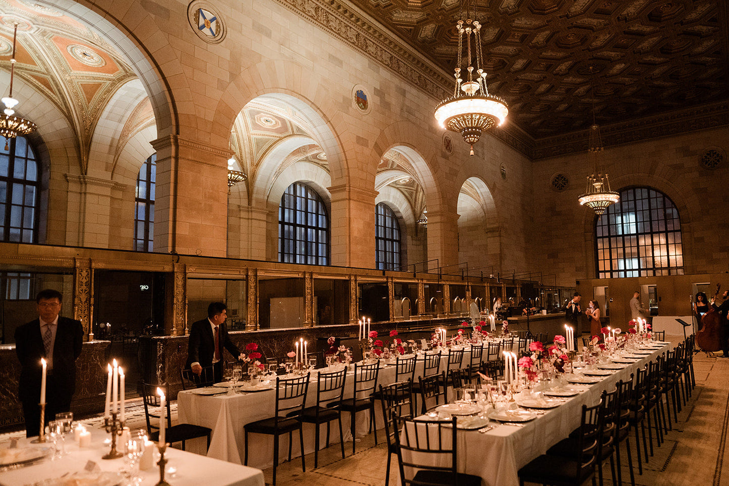 Crew cafe Montreal with long tables set for a wedding, featuring elegant floral arrangements and candles